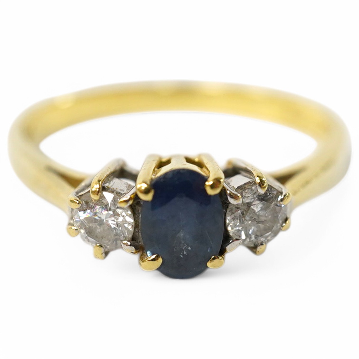 A modern 18ct gold, single stone sapphire and two stone diamond set ring, size Q, gross weight 3 grams. Condition - poor to fair